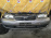 Ноускат Nissan Sunny B15 QG18 '2002- a/t дефект крепления левой фары ф. 1602 (Серебро)