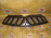 Решетка радиатора Mitsubishi L200 KA9T '2006-2010 Дефект 7450A005 (Не крашенный)