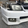 Ноускат Nissan Wingroad Y11 QG '1999-2002 a/t AEROS (без габаритов)(дефект крепления бампера) ф.1633 чёрн. т.2177