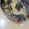 Колодки тормозные Toyota Vitz/Yaris/Belta/Corolla/Corolla Fielder KSP9/NZE140 с пружинками зад, лев