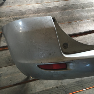 Бампер Mazda Demio DY3W '2002-2005 зад