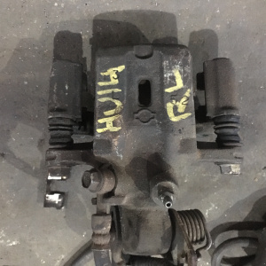 Суппорт NISSAN P11/U14 зад, лев