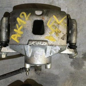 Суппорт NISSAN K12/Z11 перед, лев