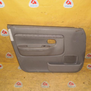 Обшивка двери Mazda Demio DW3W '1999-2002 перед, лев