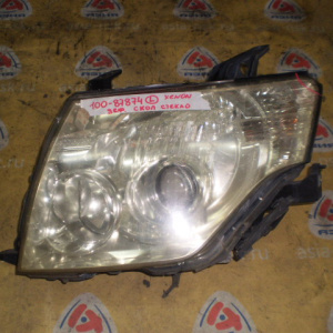 Фара MITSUBISHI 100-87874 лев Pajero V93W '2006-2011 Xenon Дефект стекла (скол)