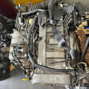 Двигатель Mazda FP-461858 2WD КАТУШКИ С БОКУ  без генератора Capella