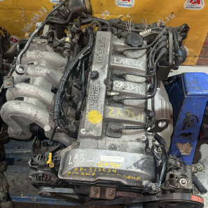 Двигатель Mazda FP-513524 2WD КАТУШКИ С БОКУ  без генератора Capella